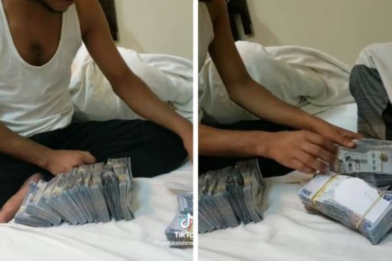 حدث داخل السعودية.. مقيم يمني يستعرض كمية كبيرة من النقود يشعل مواقع التواصل و يثير غضباً واسعاً.. صورة